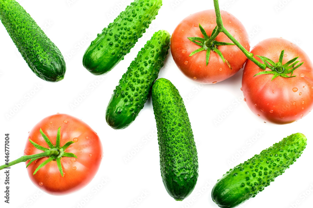 Fresh tomatoes and cucumbers, vegetables on a white background Fresh tomatoes and cucumbers, vegetables on a white background