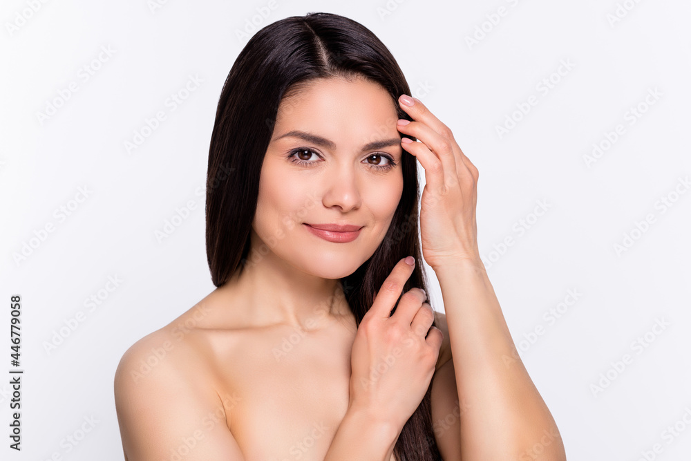 Photo portrait brunette woman touching silky hair smiling isolated white color background Photo portrait brunette woman touching silky hair smiling isolated white color background