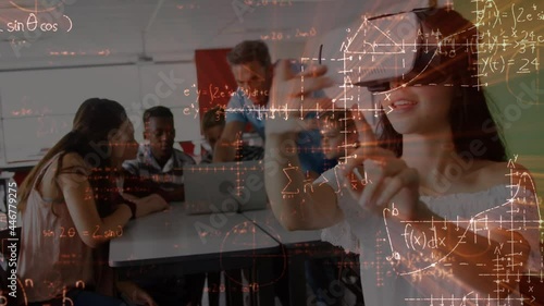 Mathematical equations floating against caucasian girl wearing vr headset at elementary school photo