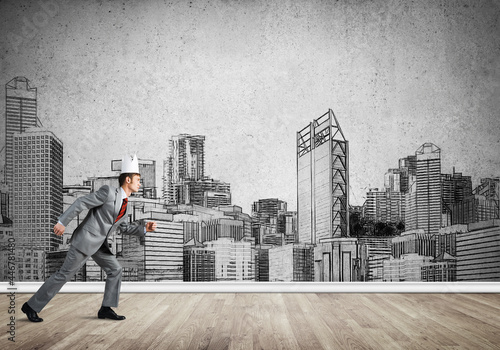 King businessman in elegant suit running and drawn cityscape silhouette at background