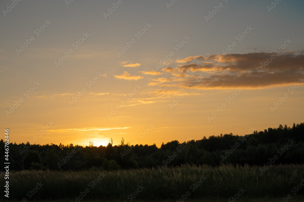 sunset in the village against the background of the forest sunset in the village against the background of the forest