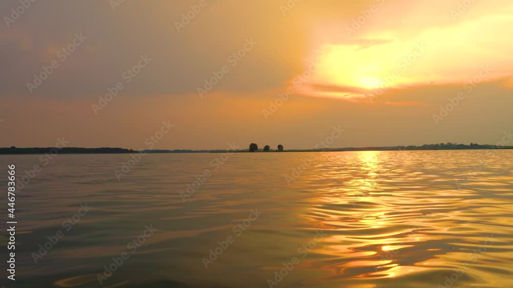 Lake view at sunset, afterglow in the sky and reflection of trees by the lake in the water, Lake view at sunset, afterglow in the sky and reflection of trees by the lake in the water,