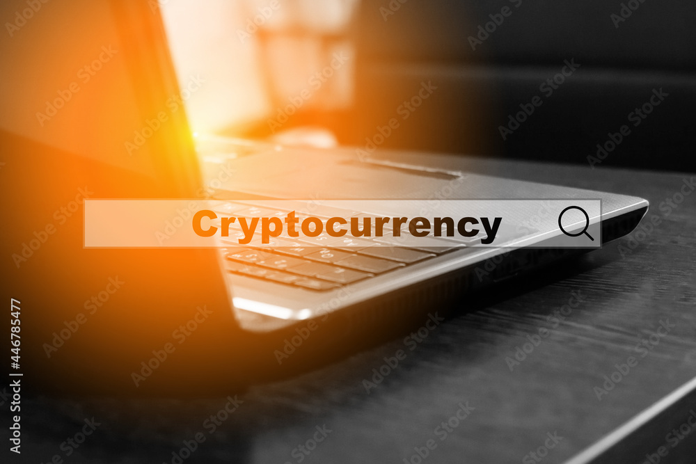 Cryptocurrency - in a search query on a laptop. Concept for studying the issue of investing in cryptocurrency