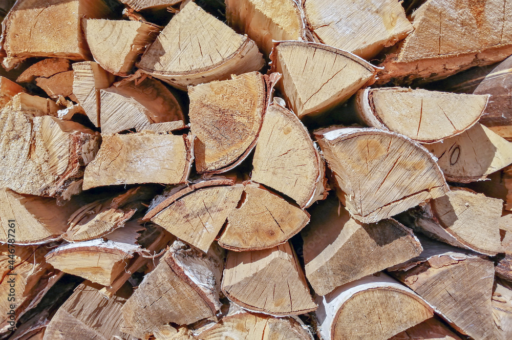 Folded birch firewood close-up. Wooden texture, background. Folded birch firewood close-up. Wooden texture, background.
