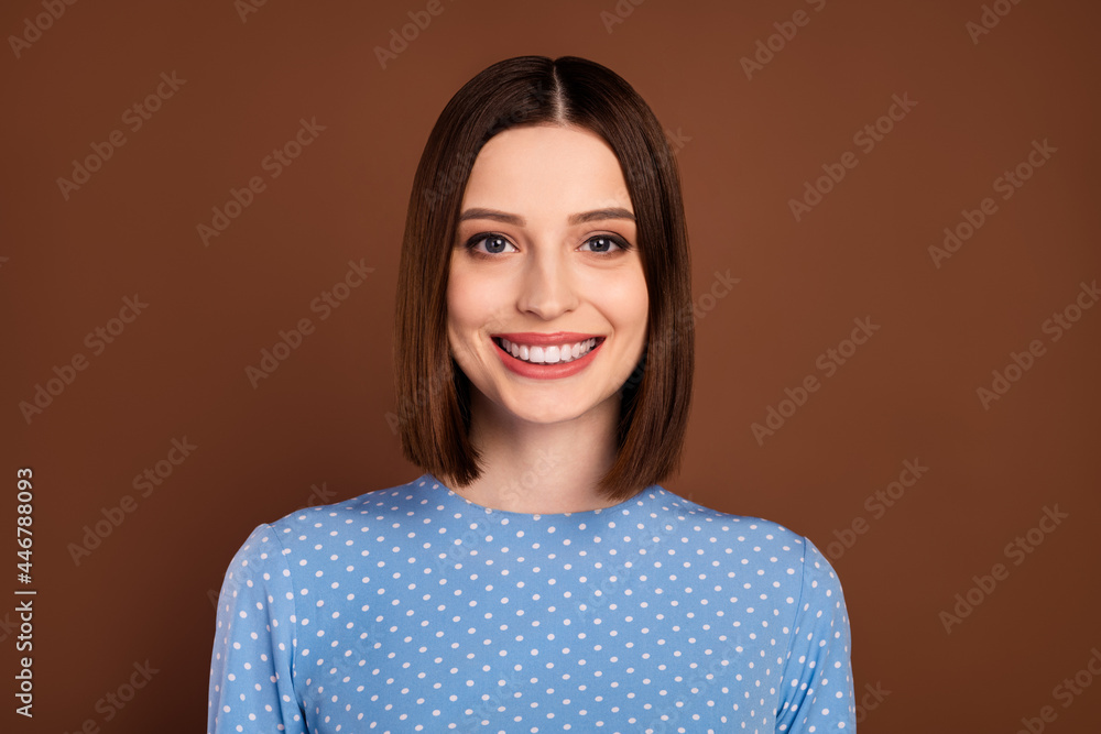 Fototapeta premium Photo of optimistic bob hairdo young lady wear blue shirt isolated on brown color background