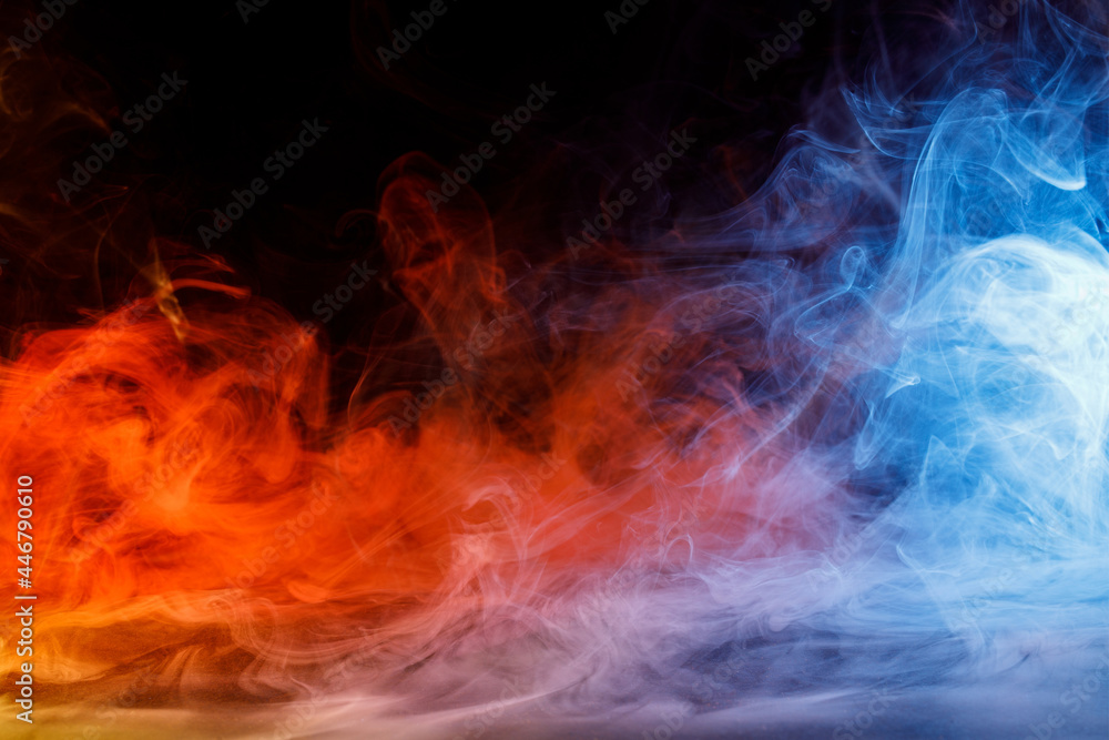 Art photo of colorful smoke moves on black background. Beautiful swirling colorful smoke. Art photo of colorful smoke moves on black background. Beautiful swirling colorful smoke.