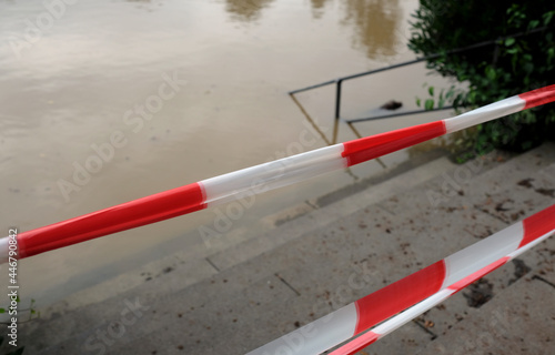 Extreme weather - closed park entrance following heavy rainfalls which turned a field in Düsseldorf, Germany, into a lake