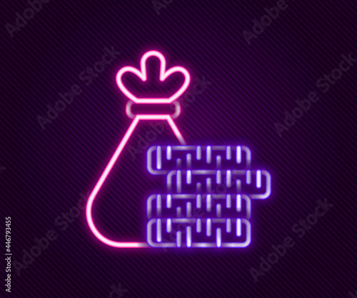 Glowing neon line Money bag and coin icon isolated on black background. Dollar or USD symbol. Cash Banking currency sign. Colorful outline concept. Vector