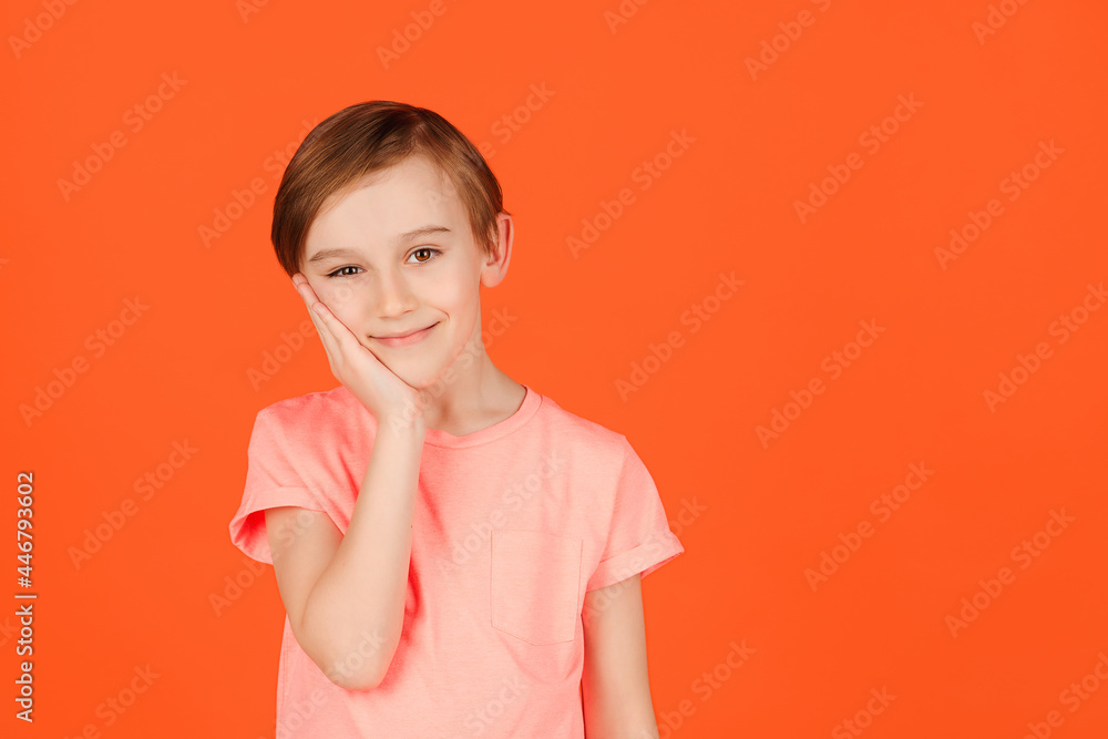 Cute handsome smiling preteen boy posing at studio. Portrait of a cheerful young boy. Cute handsome smiling preteen boy posing at studio. Portrait of a cheerful young boy.