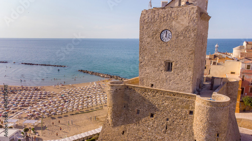 The ancient village and the Castello Svevo castel with the beach in the background during a summer day in Termoli , Molise , Italy