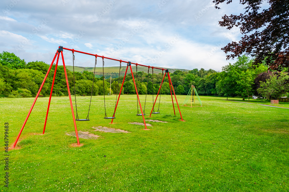 Empty children's swings Empty children's swings
