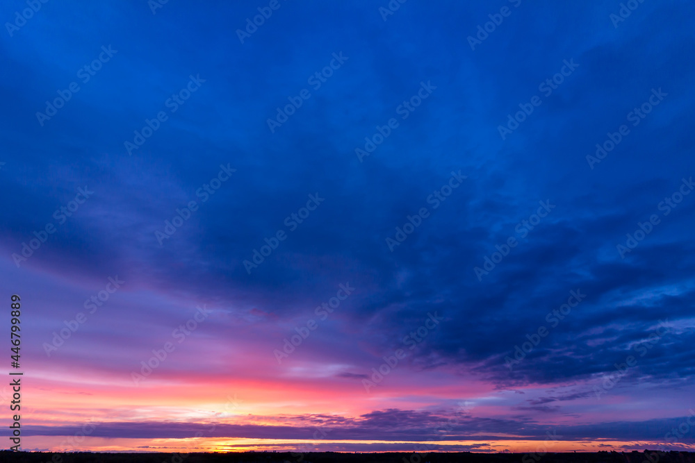 Fototapeta premium Colorful sunset with clouds in the evening