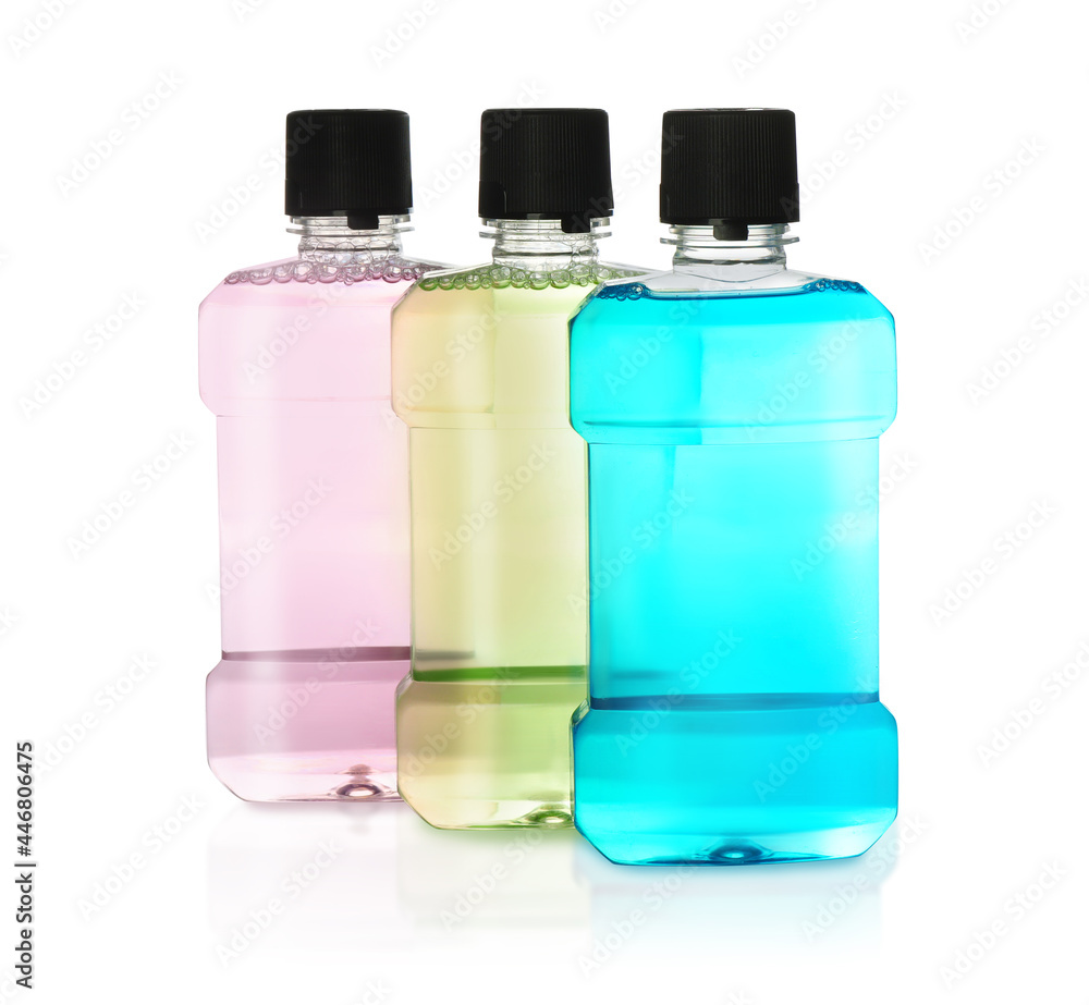 Bottles with mouthwash for teeth care on white background Bottles with mouthwash for teeth care on white background