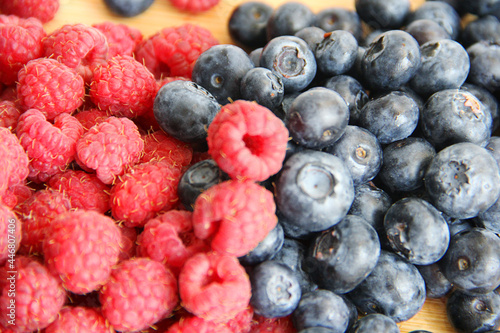 blueberries and raspberries on a plate