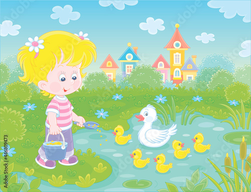 Little girl farmer standing with a bucket of feed grain and feeding a merry brood of small yellow ducklings and a cute white duck on a pond in a village, vector cartoon illustration