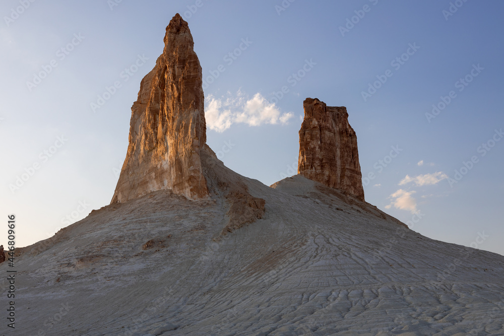 Two sharp peaks of Bozjyra (or Boszhira), frequently called the fangs. Ustyurt Plateau, Mangystau region, Kazakhstan.