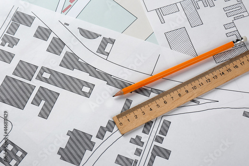 Obraz na plátně Pencil and ruler on cadastral maps of territory with buildings, flat lay