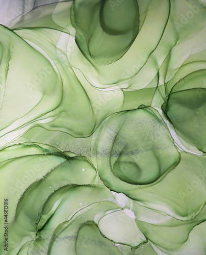 Modern abstract painting made of alcoholic ink. Green abstract painting background. Abstract green background, wallpaper. Modern art. Paint marble texture. 