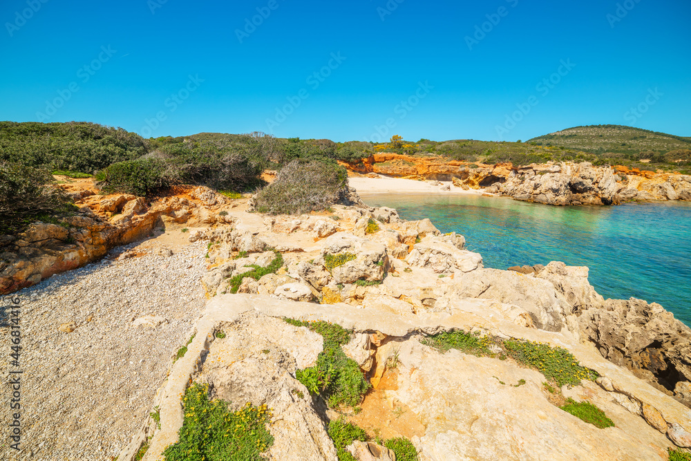 Small cove in Alghero under a blue sky Small cove in Alghero under a blue sky