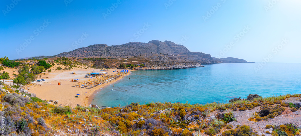 Agia Agathi Beach in a closed bay also know as Golden Sand Beach. Good place for beach leisure and water attraction. Vacation on Greece islands in Mediterranean sea. Charaki. East Rhodes. Greece
