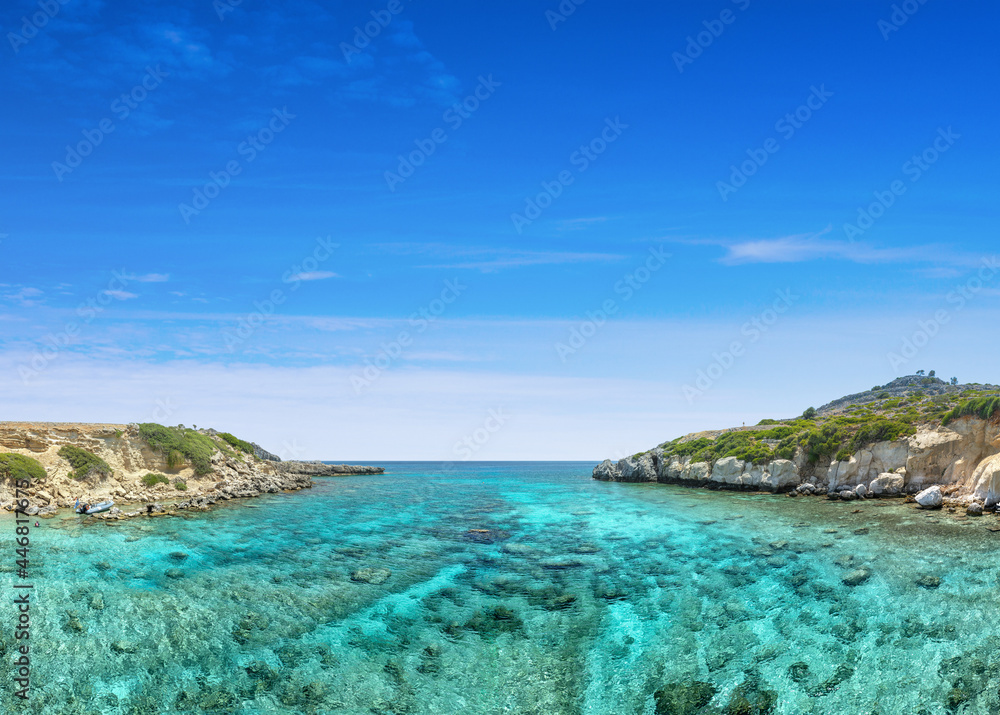 Crystal clear turquoise water in a Fokia closed bay. One of the famous places for great snorkeling. Vacation concept on Greece islands in Aegean and Mediterranean sea. Pefki. East Rhodes. Greece