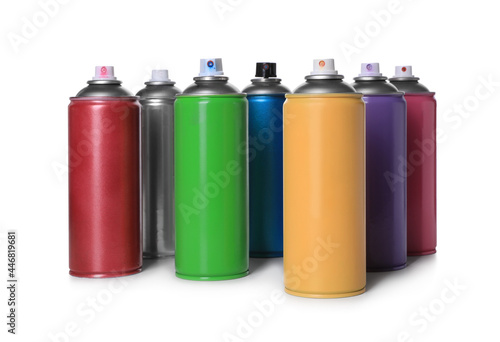 Cans of different spray paints on white background. Graffiti supplies