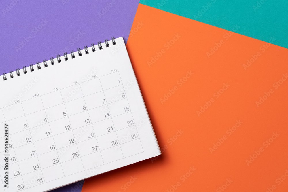 close up of calendar on the colorful table background, planning for business meeting or travel planning concept close up of calendar on the colorful table background, planning for business meeting or travel planning concept