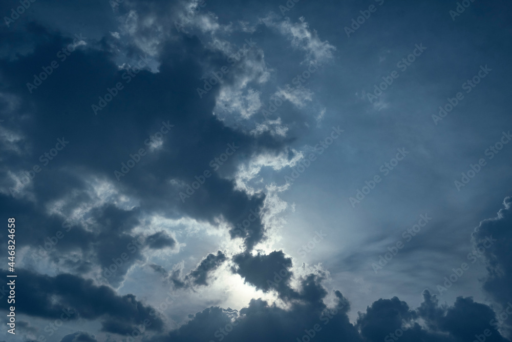 Dark rain clouds hovering in deep blue sky, forming a spectacular cloudscape . Photo taken during monsoon season in Kolkata, West Bengal.