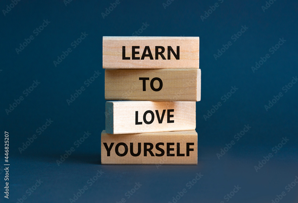 Learn to love yourself symbol. Concept words 'Learn to love yourself ' on wooden blocks on a beautiful grey background. Businessman hand. Business, psychological and learn to love yourself concept. Learn to love yourself symbol. Concept words 'Learn to love yourself ' on wooden blocks on a beautiful grey background. Businessman hand. Business, psychological and learn to love yourself concept.