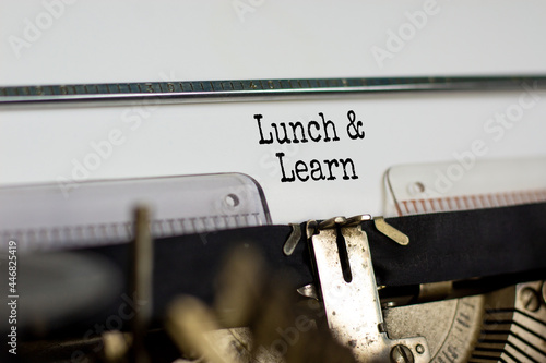 Lunch and learn symbol. Words 'Lunch and learn' typed on retro typewriter. Business, educational and lunch and learn concept. Copy space.