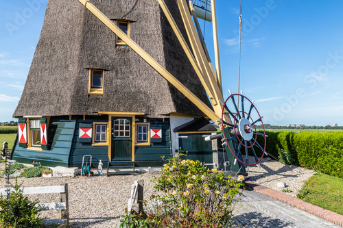 Inhabited polder mill located on the river Het Gein.