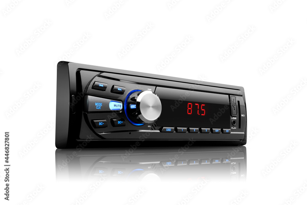 Fototapeta premium Three-quarter right view of a black automobile radio with screen on with silver button on white background with reflection underneath