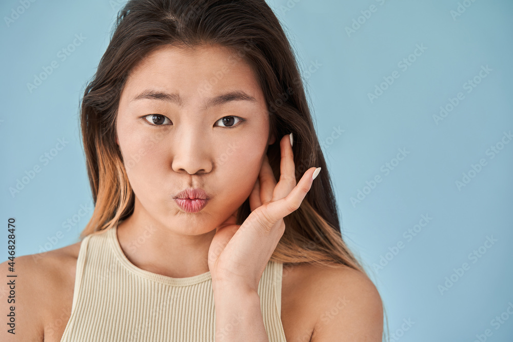 Woman looking at the camera and making funny faces during photoshoot Woman looking at the camera and making funny faces during photoshoot