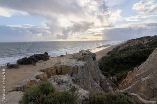unas vistas de la bella playa de Mazagon, situada en la provincia de Huelva, España. Con sus acantilados , pinos, dunas , vegetacion verde y un cielo con nubes. Atardeceres preciosos photo