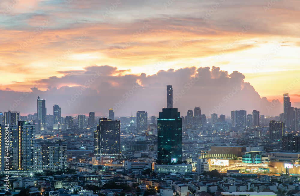 Fototapeta premium Bangkok, Thailand - Jun 02, 2021: Aerial view of Beautiful scenery view of Skyscraper Evening time Sunset creates relaxing feeling for the rest of the day. Selective focus.