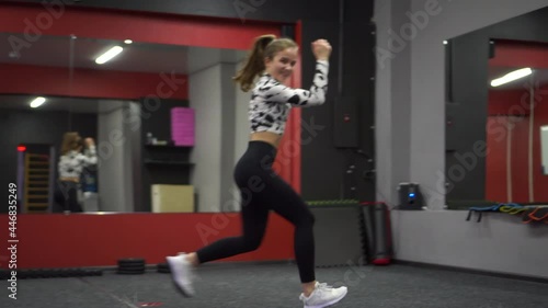 Wallpaper Mural A beautiful girl in a tight suit is engaged in fitness in the gym. Beautiful exercises. Torontodigital.ca