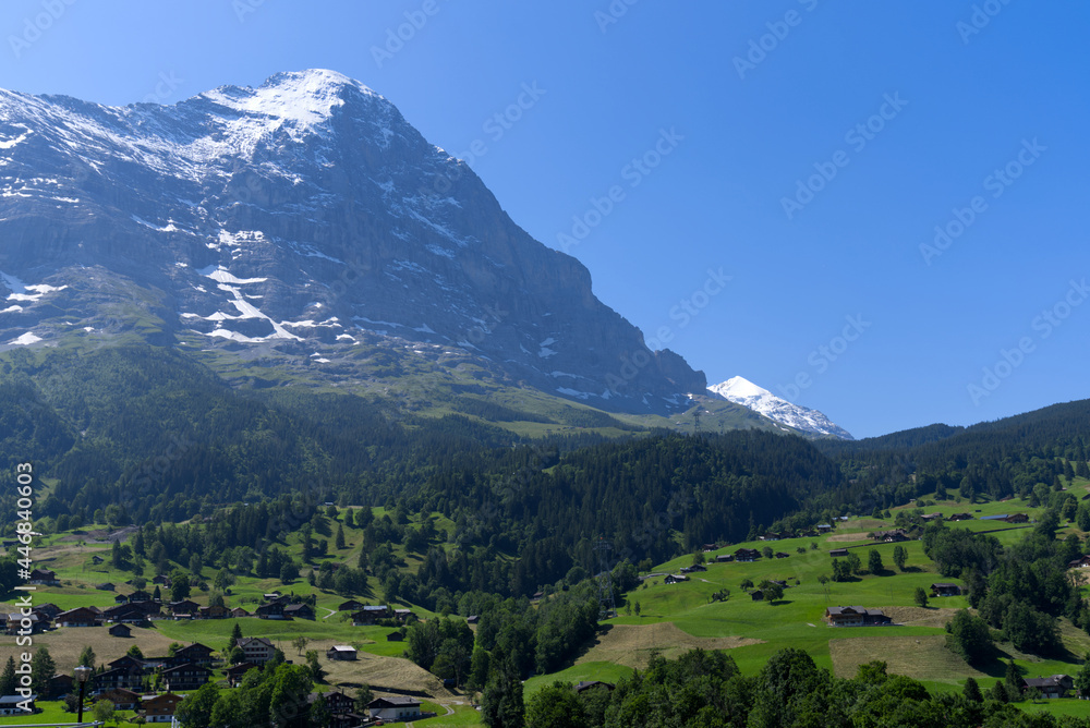 Mount Eiger on a sunny summer day seen from cable car station Grindelwald Terminal. Photo taken July 20th, 2021, Grindelwald, Switzerland. Mount Eiger on a sunny summer day seen from cable car station Grindelwald Terminal. Photo taken July 20th, 2021, Grindelwald, Switzerland.