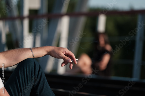Smoking guy and girl