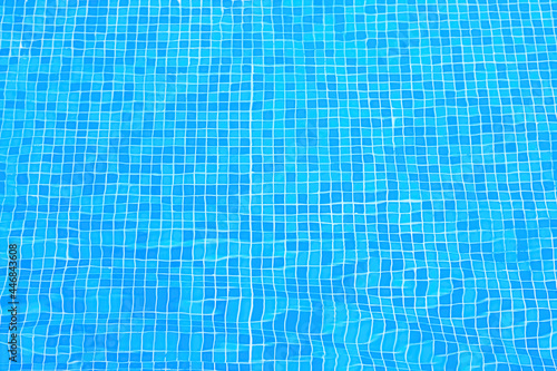 Blue tiles on the bottom of the pool.