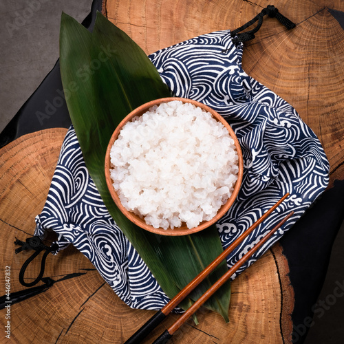 Shirataki rice or noodles on wooden table background. Konnyaku from konjac yam for wok. Healthy japanese diet. Gluten free and carbs free KETO food. Traditional oriental style. Square, close up photo
