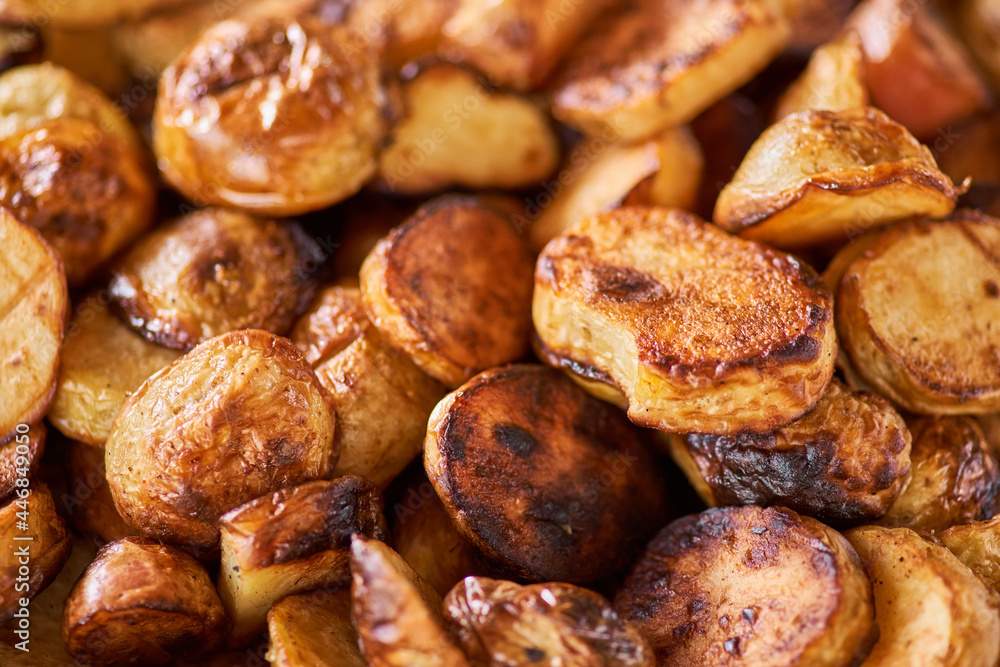 full of fried potato wedges, photo of potatoes as background
