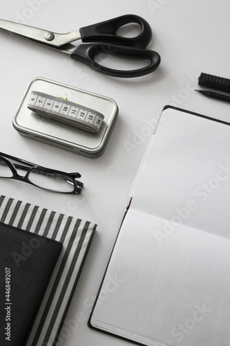 notebook pen and glasses