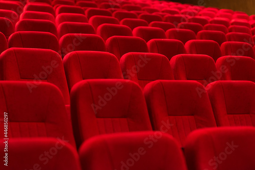 An empty cinema room with red velvet seats. Empty cinema. 