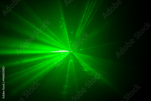 Green laser beam through the mist
