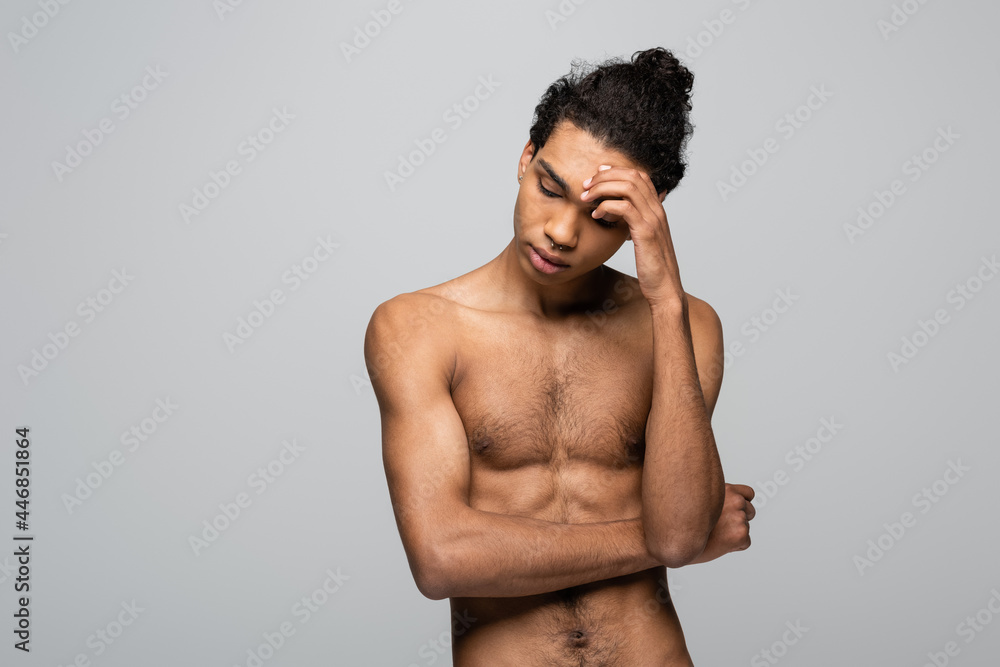 Fototapeta premium shirtless african american man touching forehead isolated on grey, beauty concept