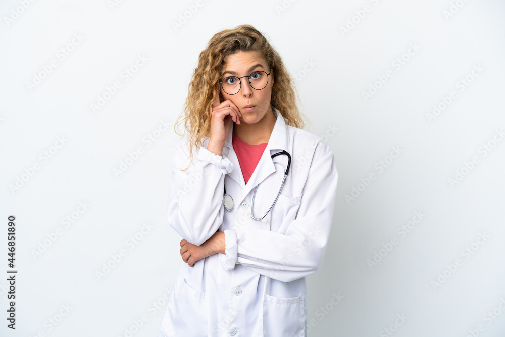 Young doctor blonde woman isolated on white background thinking an idea Young doctor blonde woman isolated on white background thinking an idea