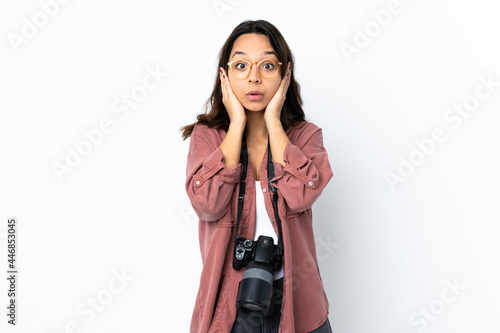 Young photographer woman over isolated white background frustrated and covering ears