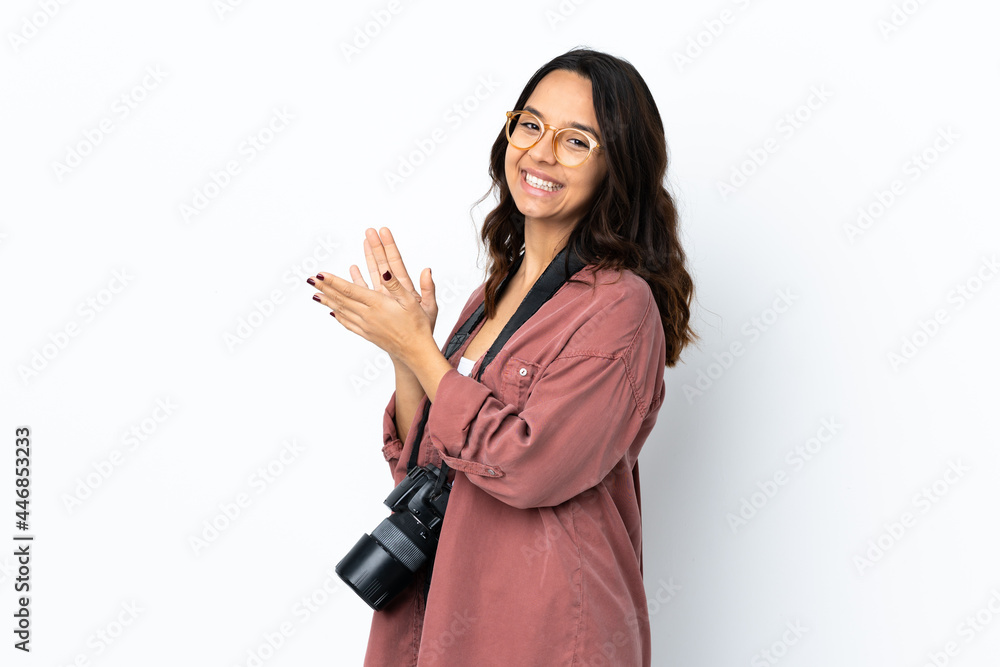 Young photographer woman over isolated white background applauding