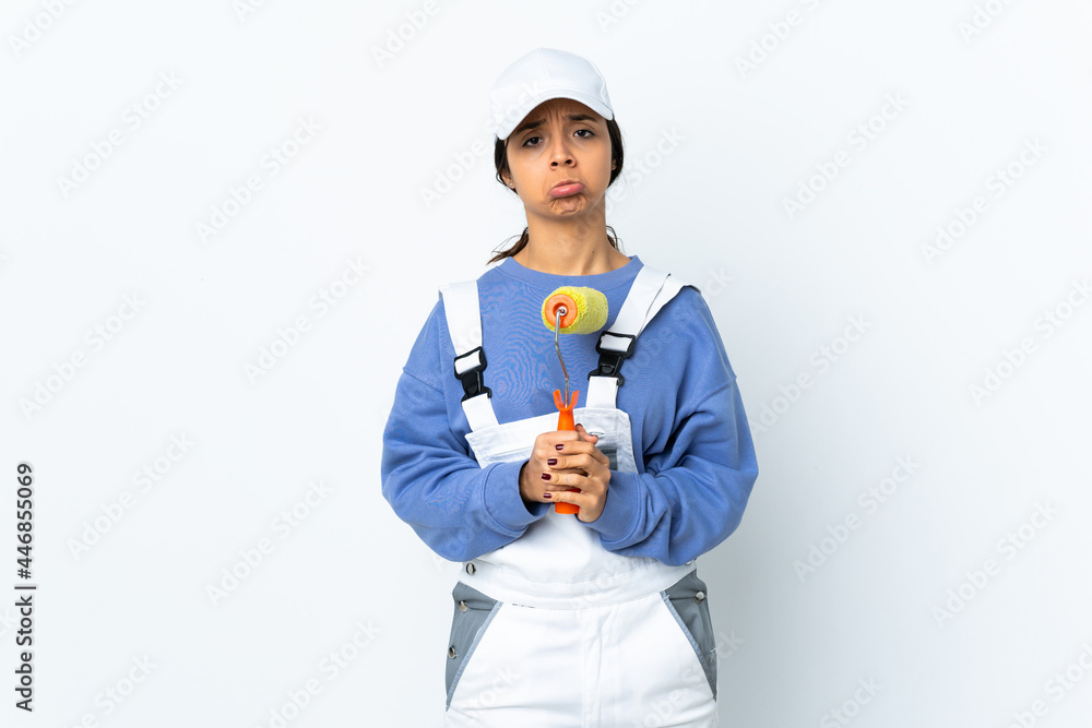 Painter woman over isolated white background keeps palm together. Person asks for something