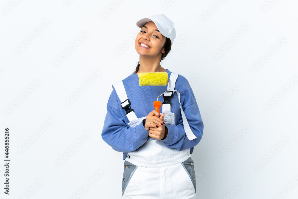 Painter woman over isolated white background keeps palm together. Person asks for something Painter woman over isolated white background keeps palm together. Person asks for something